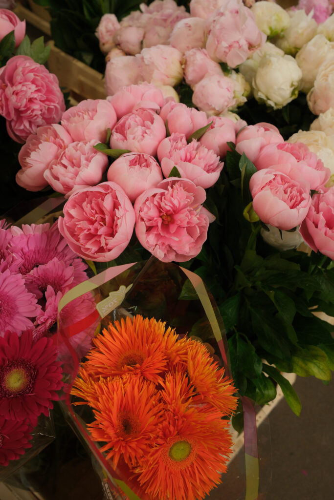 Minimal workspace with notebook and headphones symbolizing intentional learning, clarity, and long-range planning for wedding professionals.