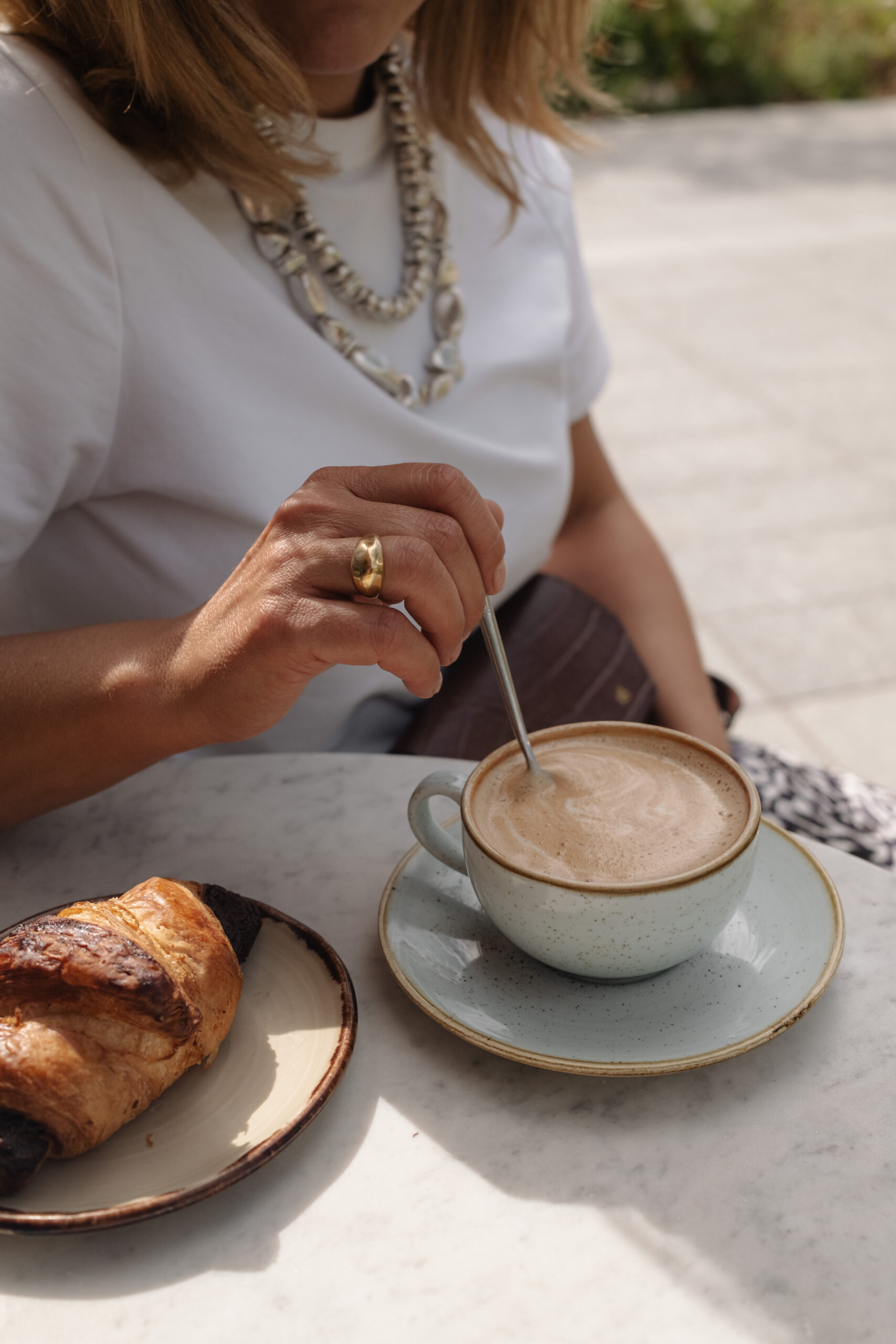 Service-based business owner reviewing marketing plans, representing visible marketing strategies designed to attract ideal, aligned clients.