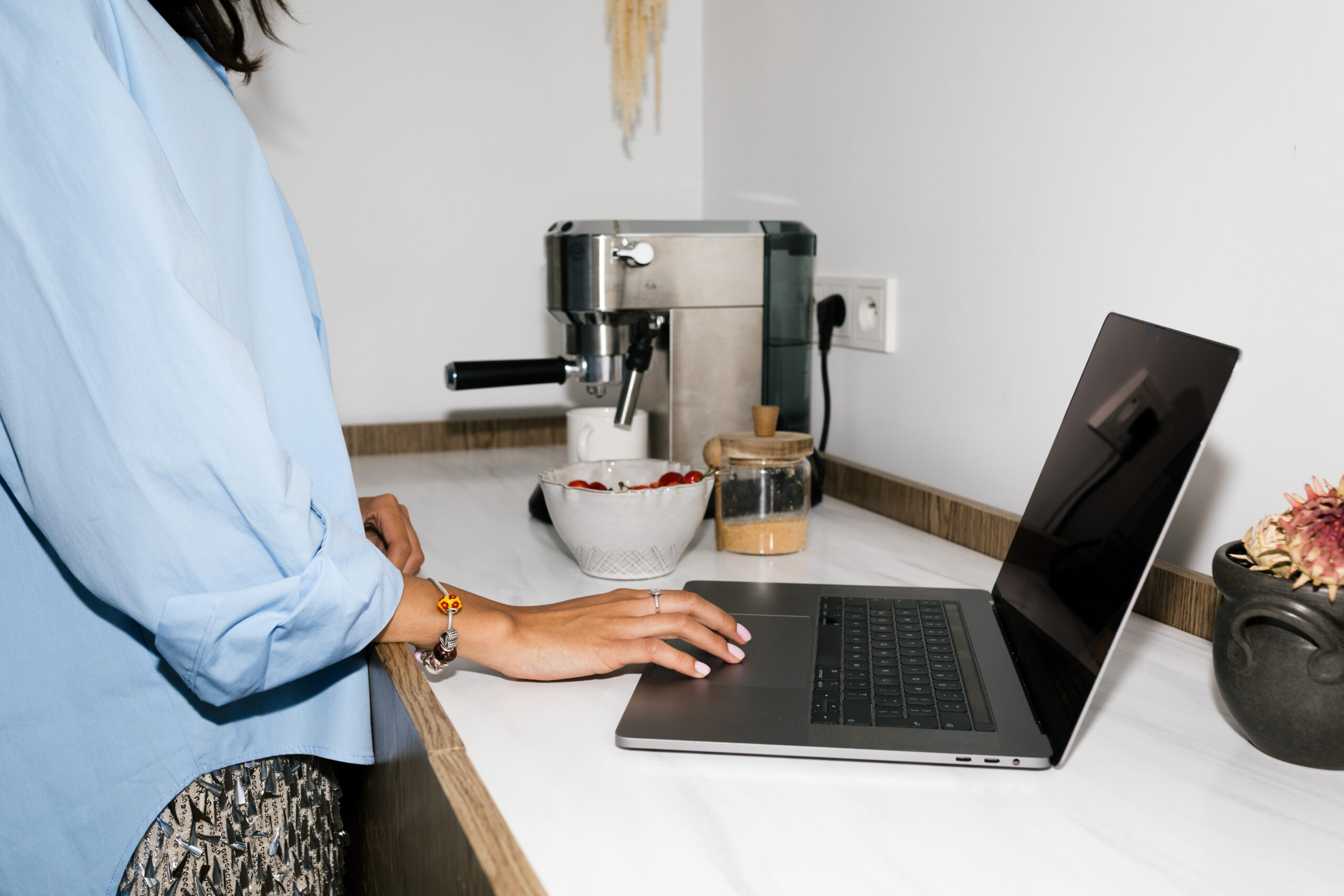 Wedding creative auditing content marketing for wedding pros on a laptop and printed portfolio in bright natural light