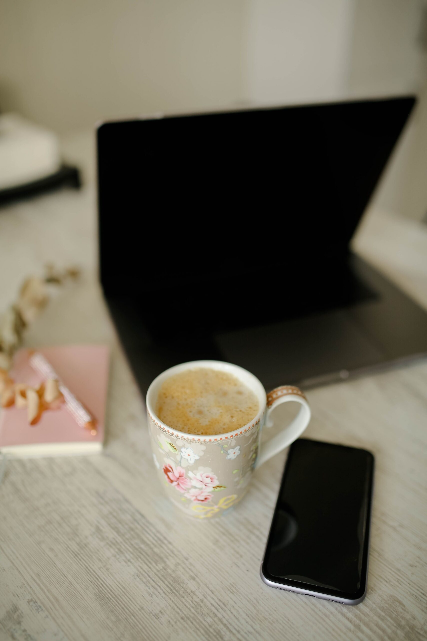 Wedding creative at her desk focused on Pinterest while Instagram sits aside, building her Pinterest marketing strategy